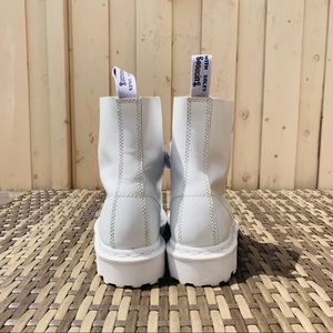 Dr. Marten Coralia in White